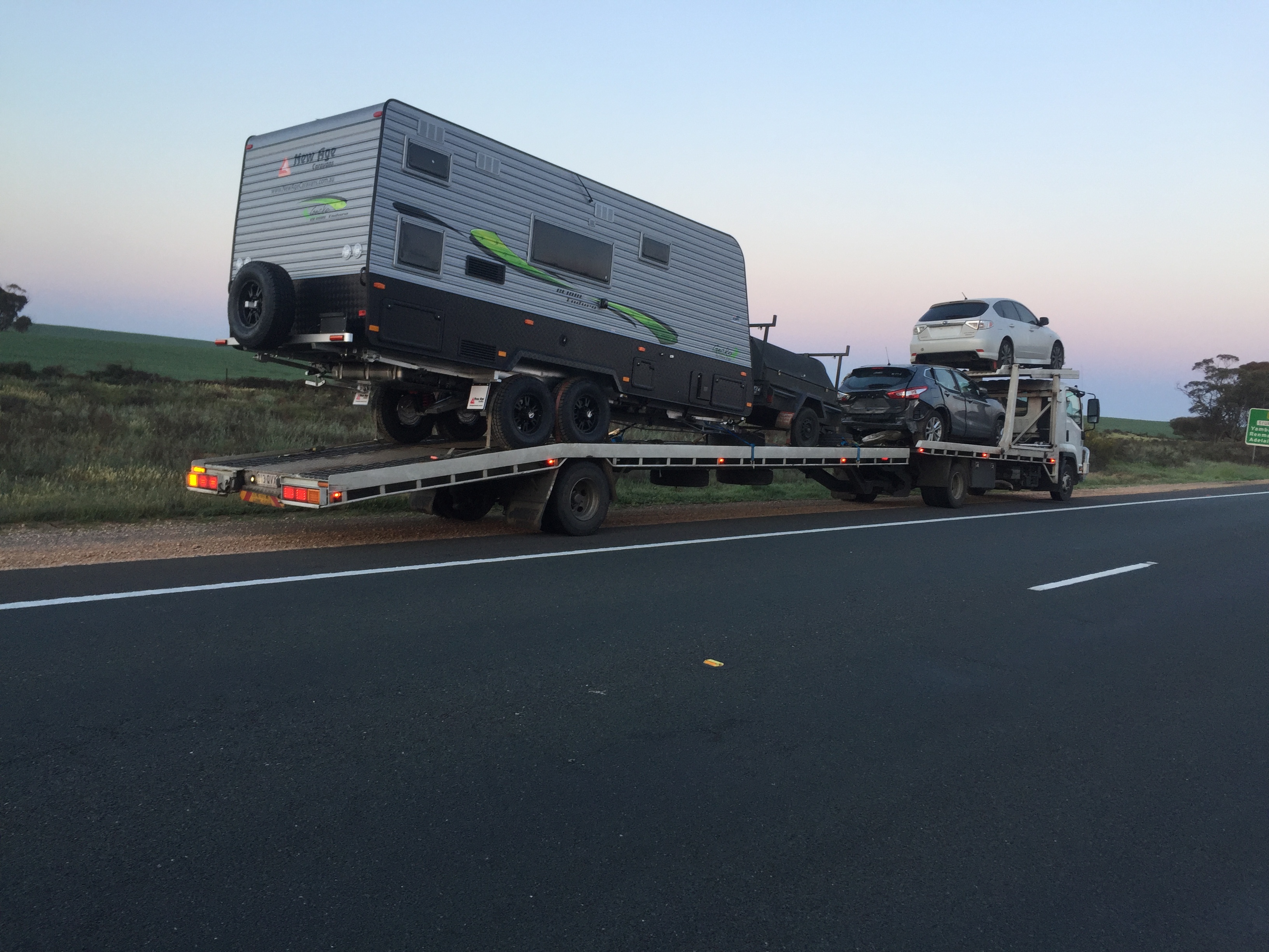 Auto Mover Transporting Caravan and Vehicles Interstate