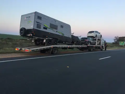Auto Mover Transporting Multiple Vehicles on Carrier Truck