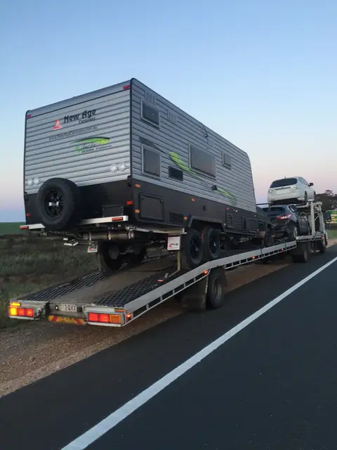 Auto Mover Transporting New Age Caravan on Flatbed