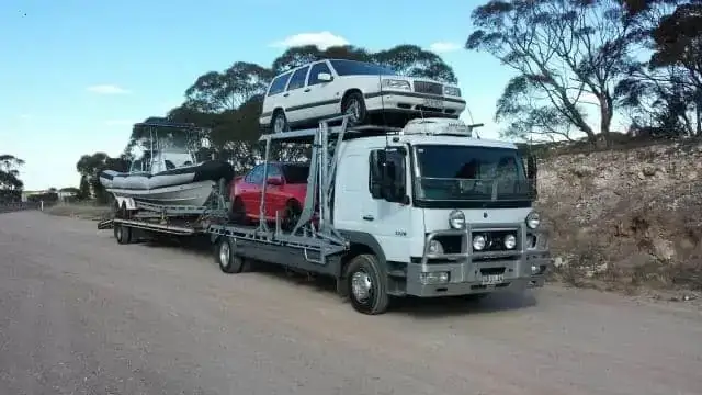 Boat transport on car carrier
