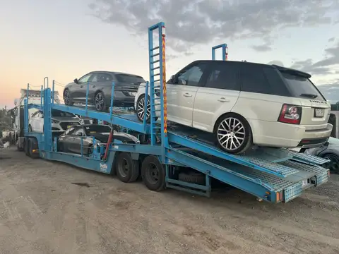 Auto Mover truck transport – Multi-Level Car Carrier Loaded With Vehicles