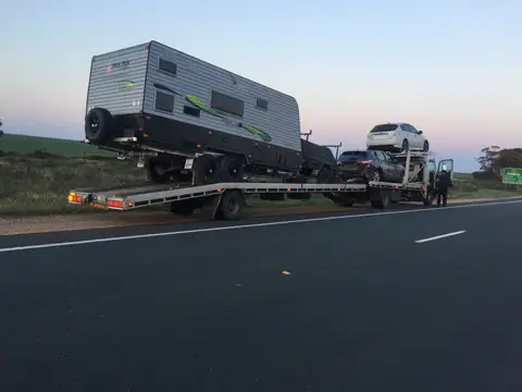 Auto Mover Transporting Caravan and Multiple Vehicles