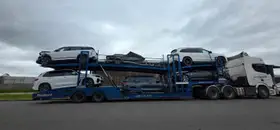 Car Carrier Loaded with SUVs and Watercraft