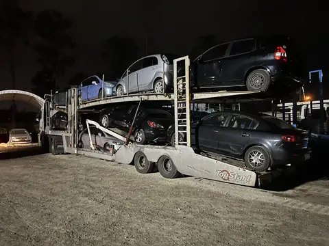 Auto Mover Car Carrier Loaded with Multiple Vehicles at Night