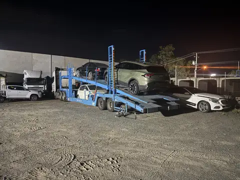 Auto Mover Car Carrier Loading Multiple Vehicles at Night