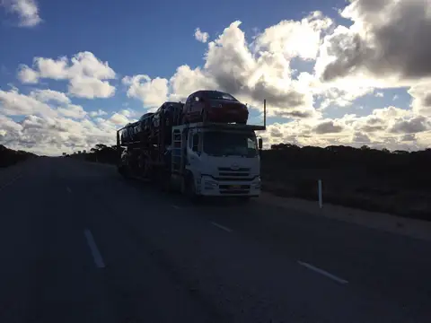 Auto Mover Car Carrier Transporting Red Sedan Interstate