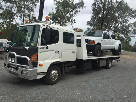 Auto Mover Ford Utility Vehicle on Flatbed Carrier