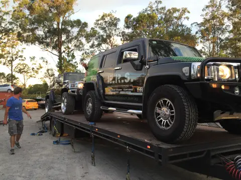 Auto Mover Hummer H3 Loaded on Flatbed Carrier