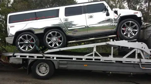 Auto Mover Hummer Limousine on Interstate Transport Carrier
