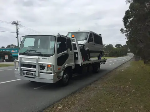 Auto Mover Isuzu Truck Transporting Vehicle on Highway