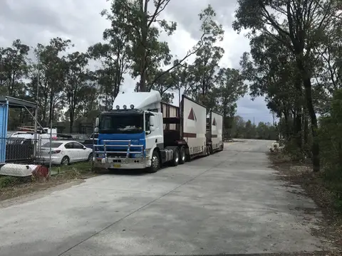 Auto Mover Livestock Transport Truck at Facility