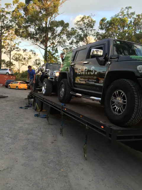 Auto Mover Loading Yellow Sports Car onto Carrier
