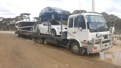 Auto Mover Multi-Vehicle Transport Load with Cars and Boat