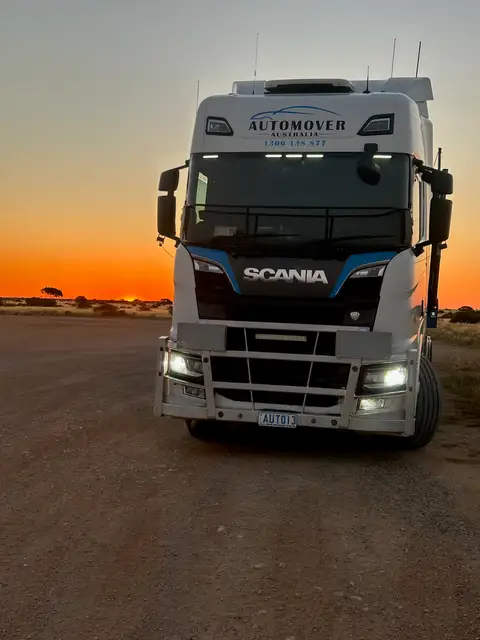 Auto Mover Scania Truck at Sunset