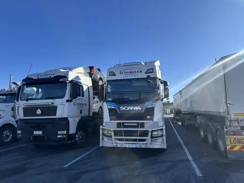 Auto Mover Scania truck carrying vehicles on highway