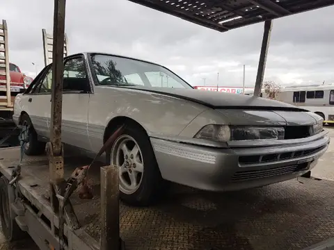 Auto Mover Silver Sedan Prepared for Interstate Transport