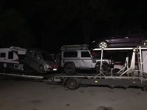 Auto Mover Transporting Multiple Vehicles on Enclosed Carrier