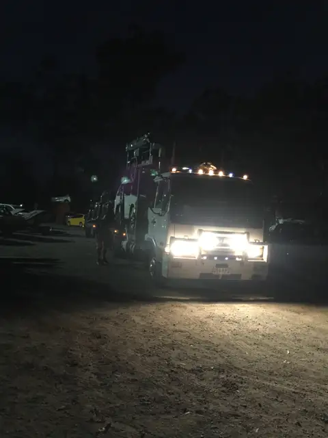 Auto Mover Truck Loading Vehicles at Night