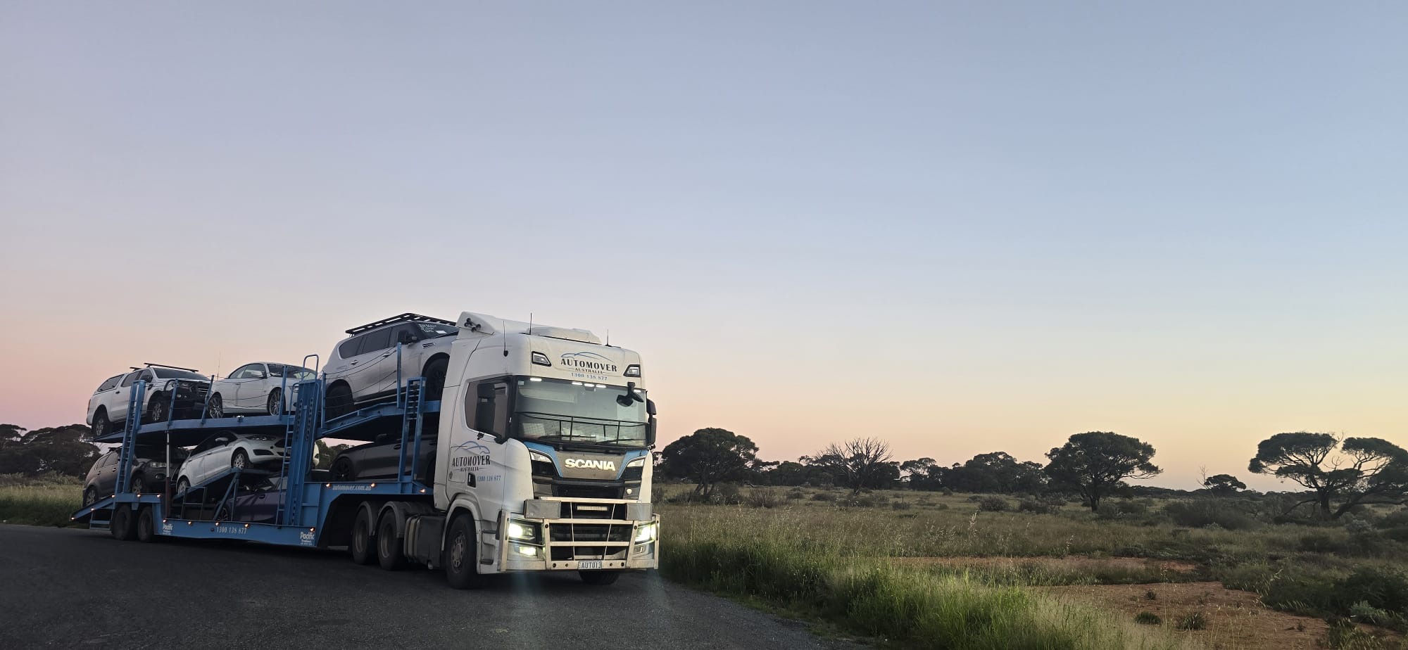 Scania Car Carrier Loaded with Vehicles at Dusk