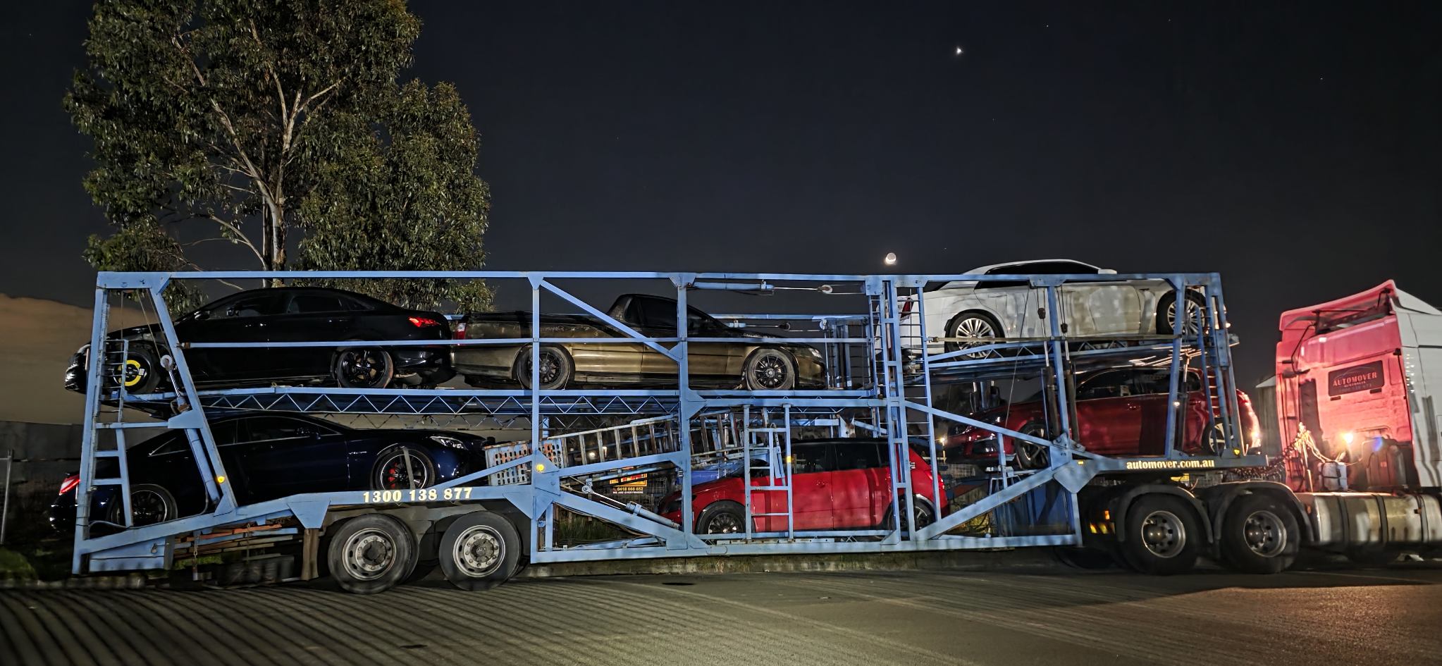 Multi-Level Car Carrier Loaded at Night
