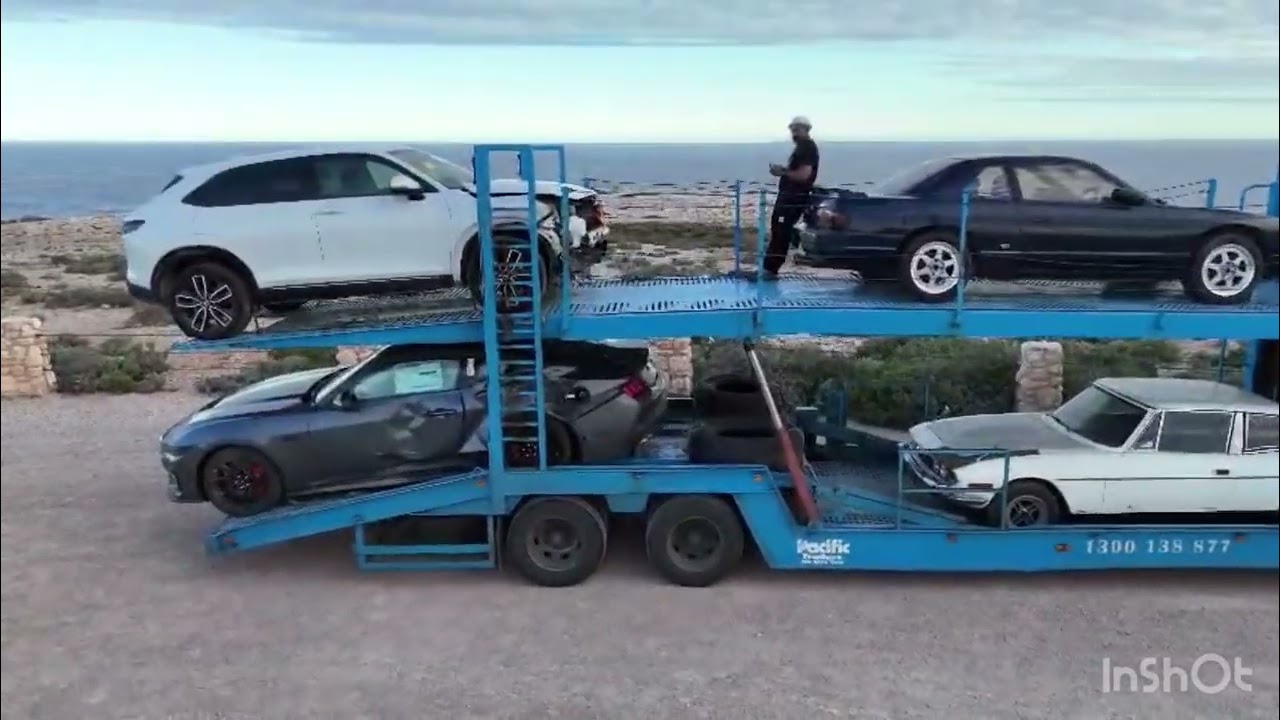 Auto Mover car transport – Car Carrier Truck Transporting Vehicles on Coastal Road
