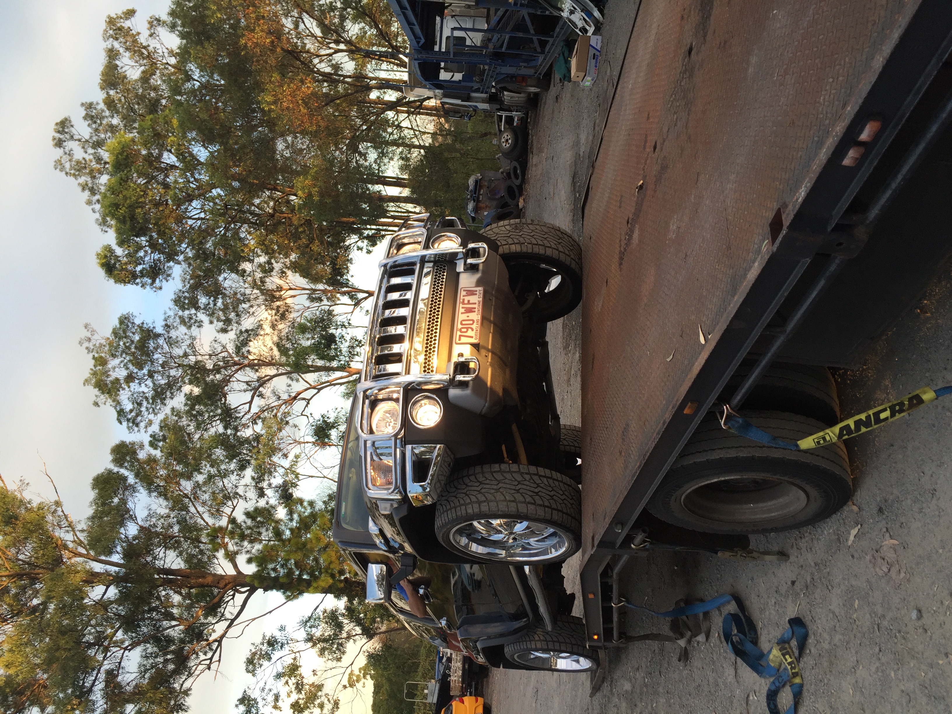 Auto Mover Black Hummer H3 Secured on Flatbed Trailer