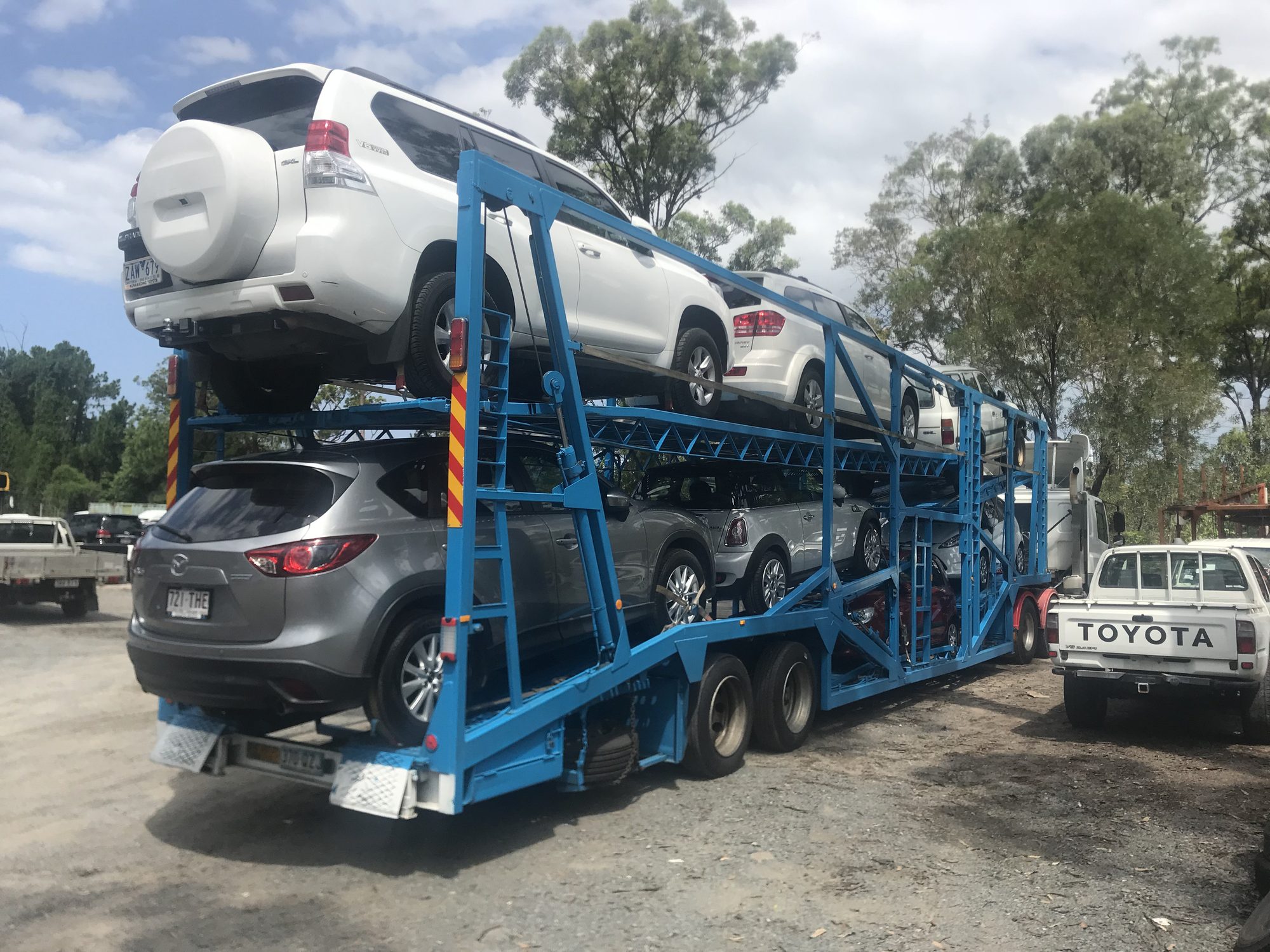 Auto Mover Blue Car Carrier Loaded with Multiple Vehicles