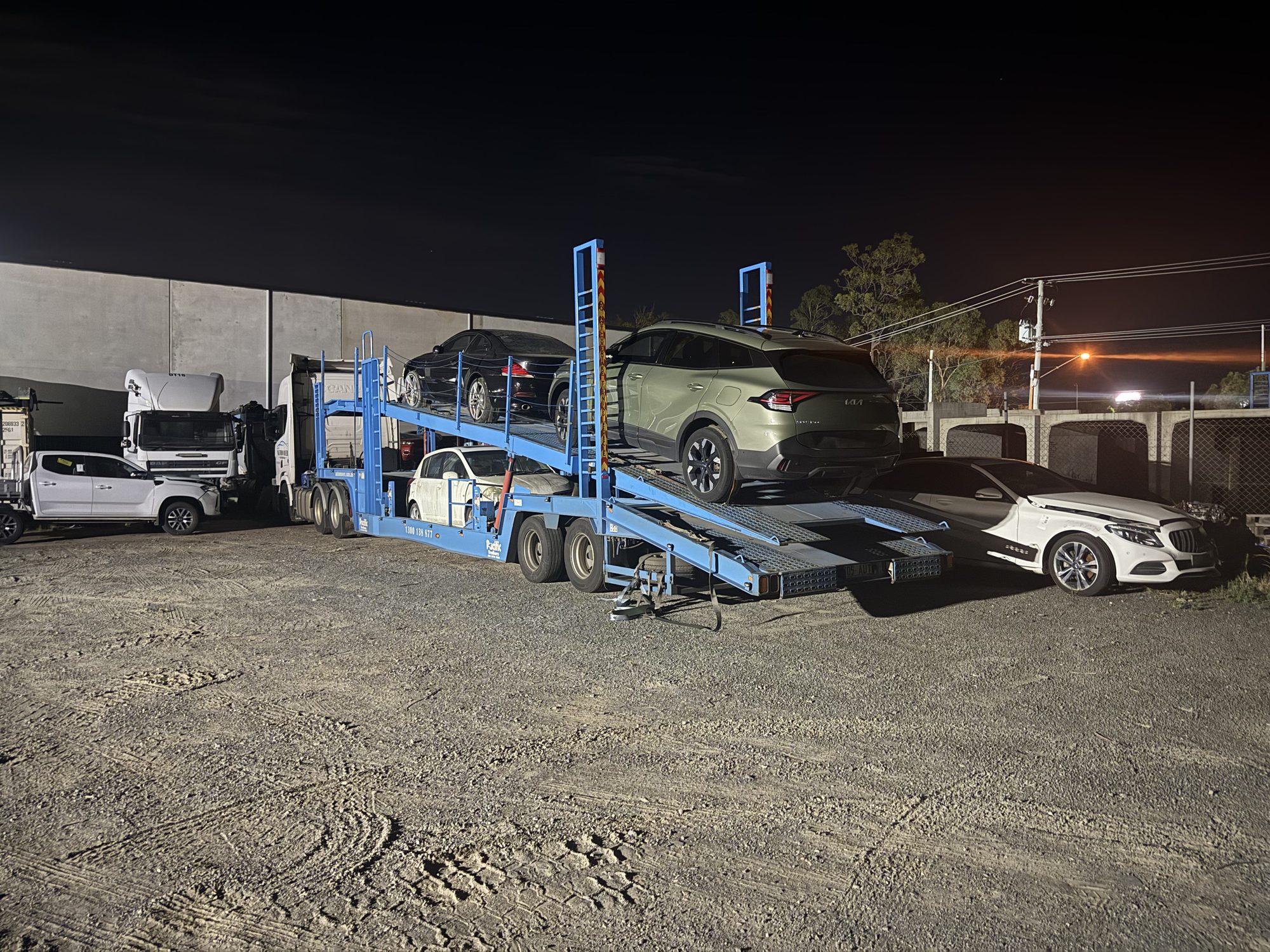 Auto Mover Car Carrier Loading Multiple Vehicles at Night