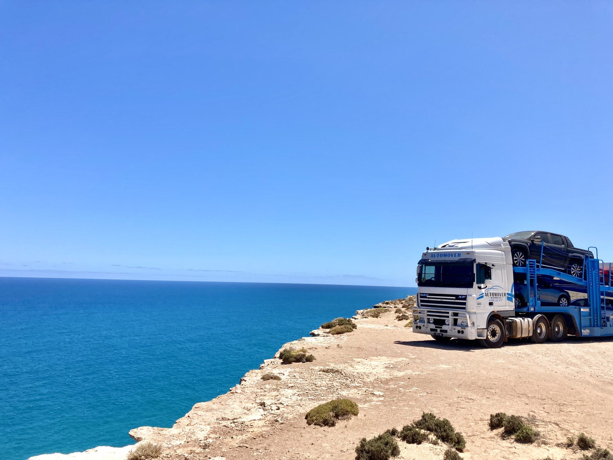 Auto Mover Car Carrier Positioned at Scenic Coastal Location