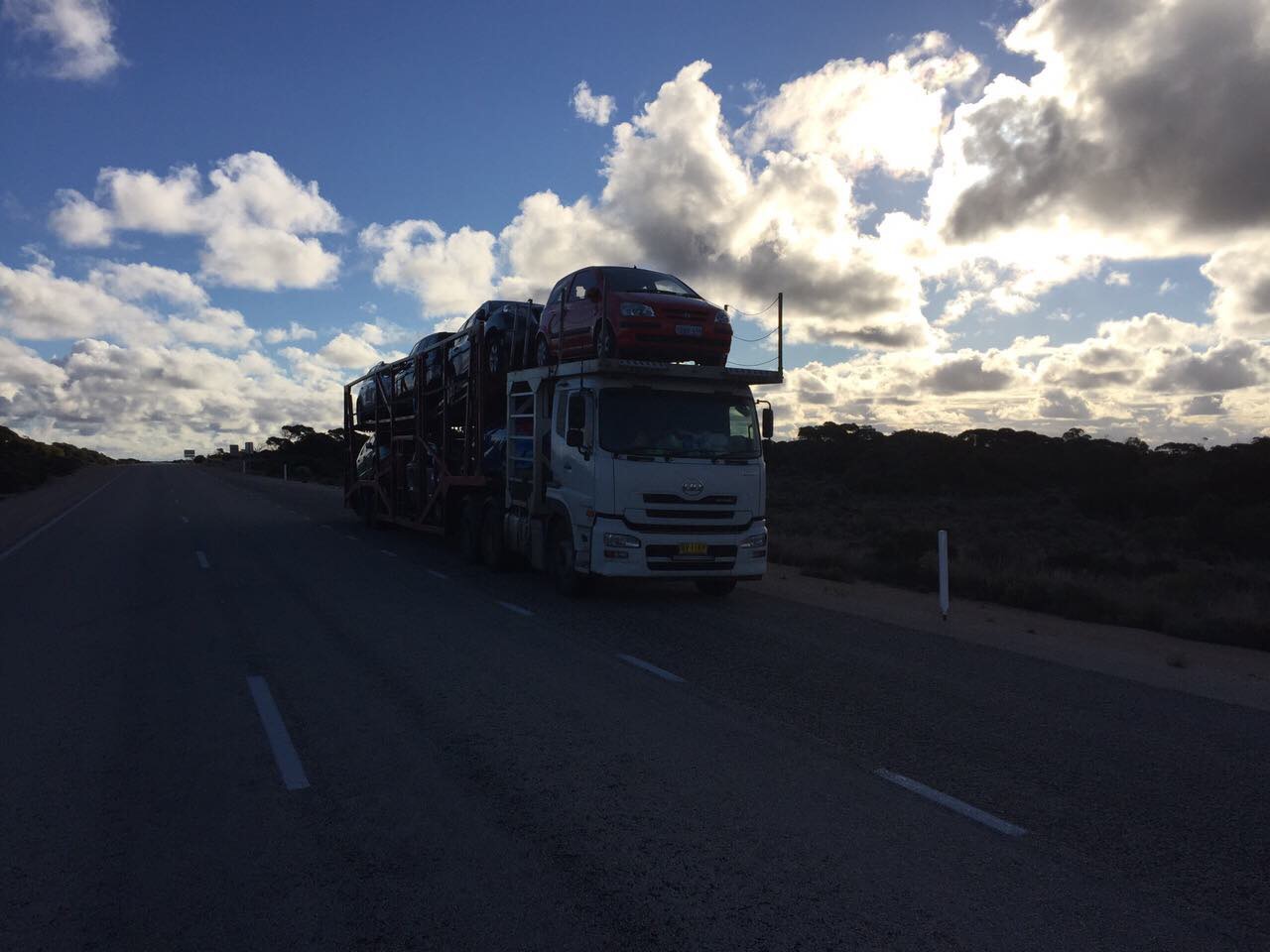 Auto Mover Car Carrier Transporting Red Sedan Interstate