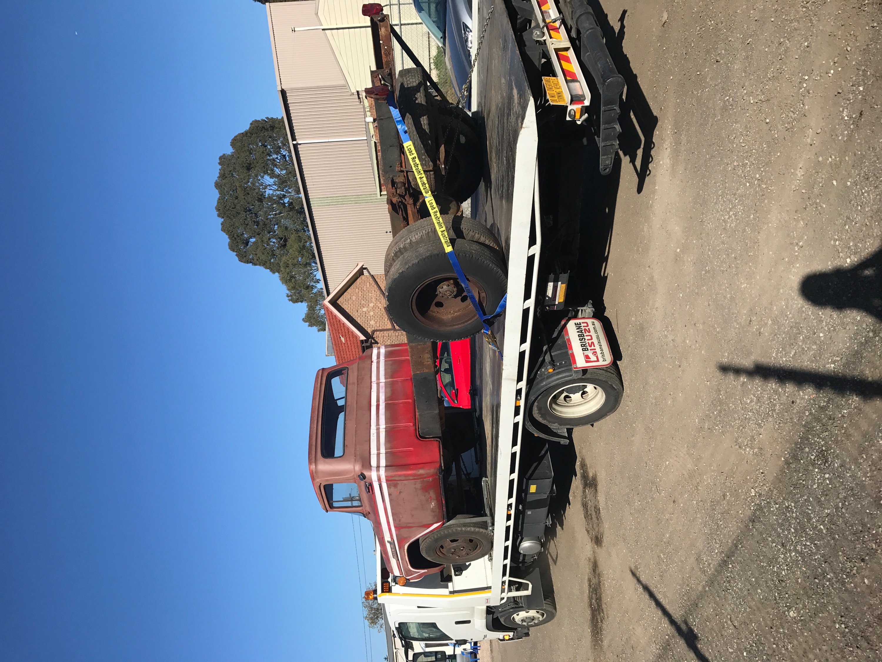 Auto Mover Classic Red Truck Loaded on Flatbed Carrier