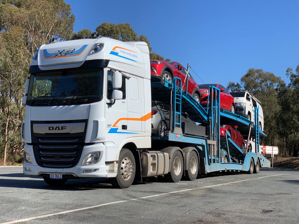 Auto Mover DAF truck transporting multiple vehicles