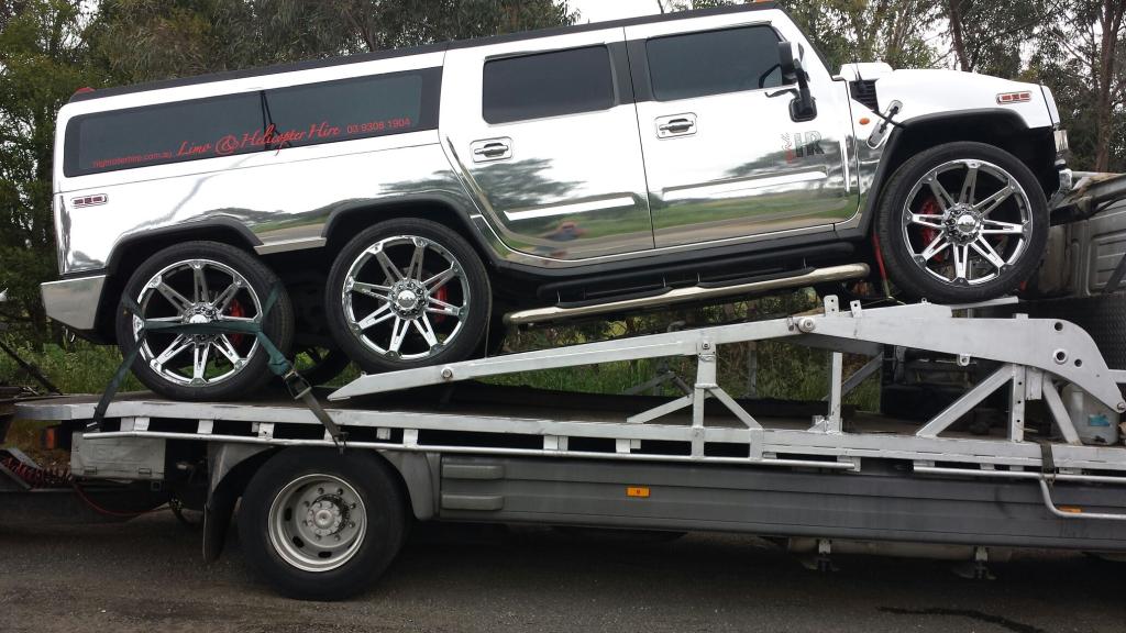 Auto Mover Hummer Limousine on Interstate Transport Carrier