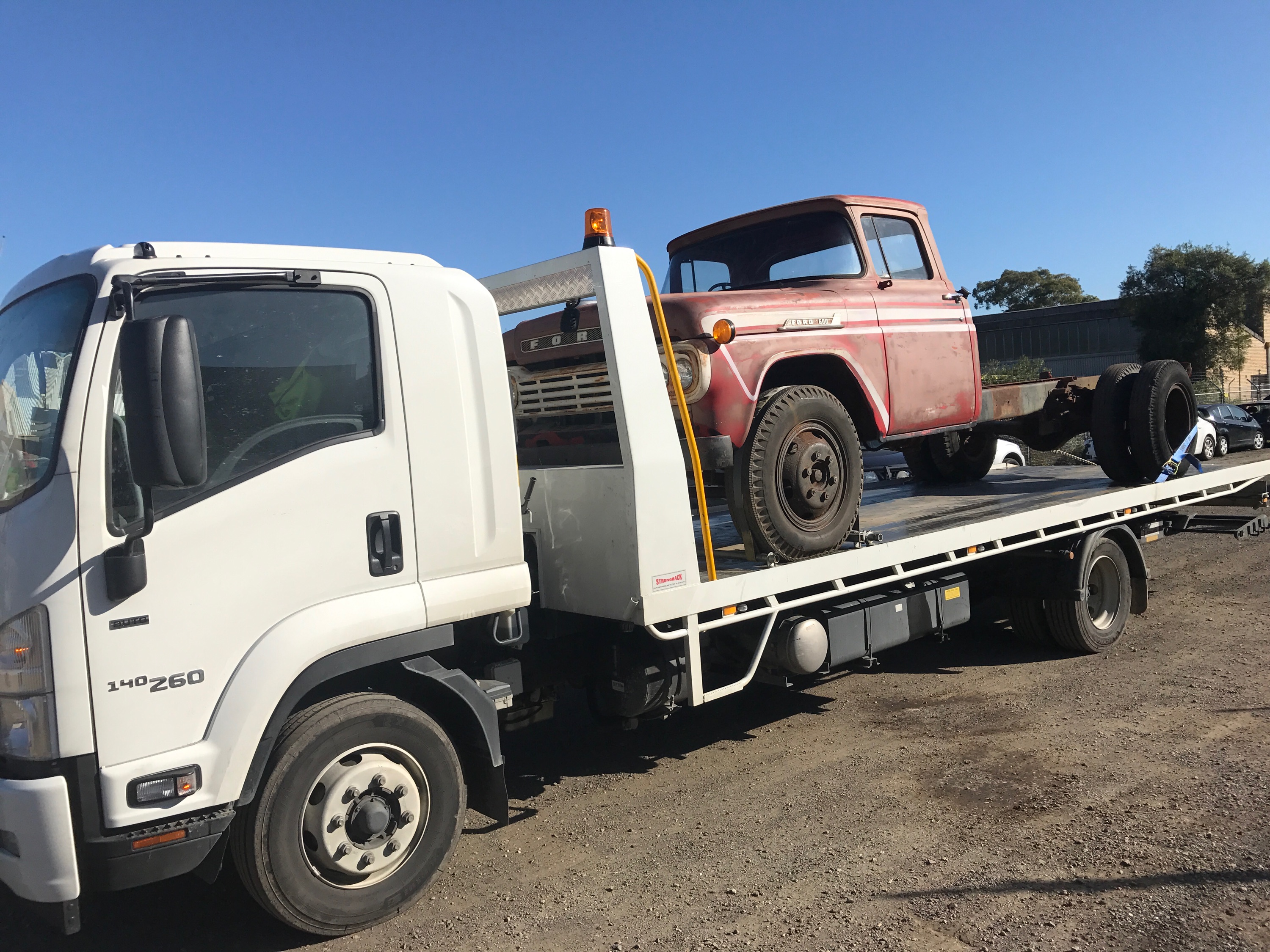 Auto Mover Isuzu Truck Transporting Vintage Ford Pickup