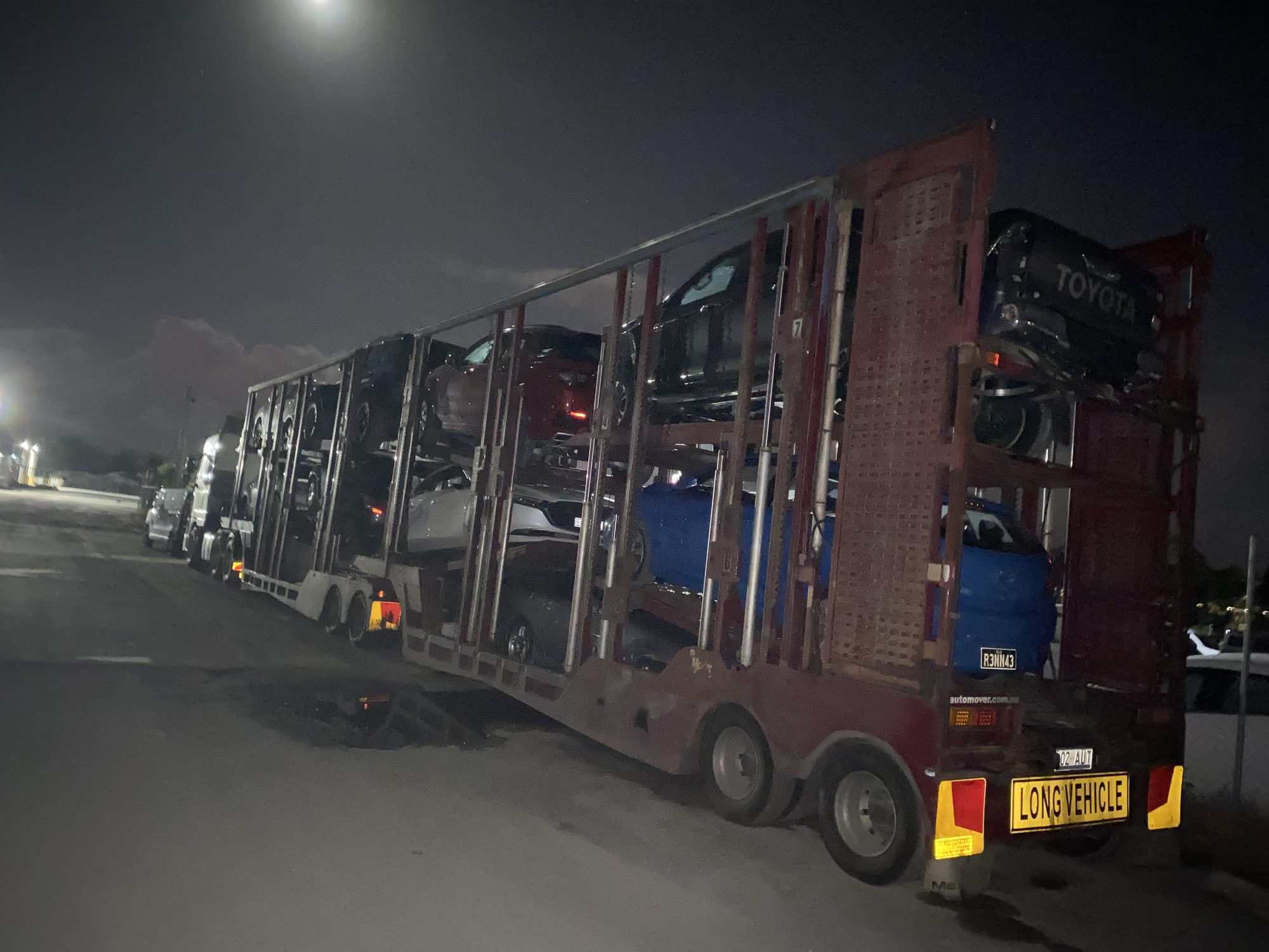 Auto Mover Multi-Vehicle Car Carrier Loaded at Night