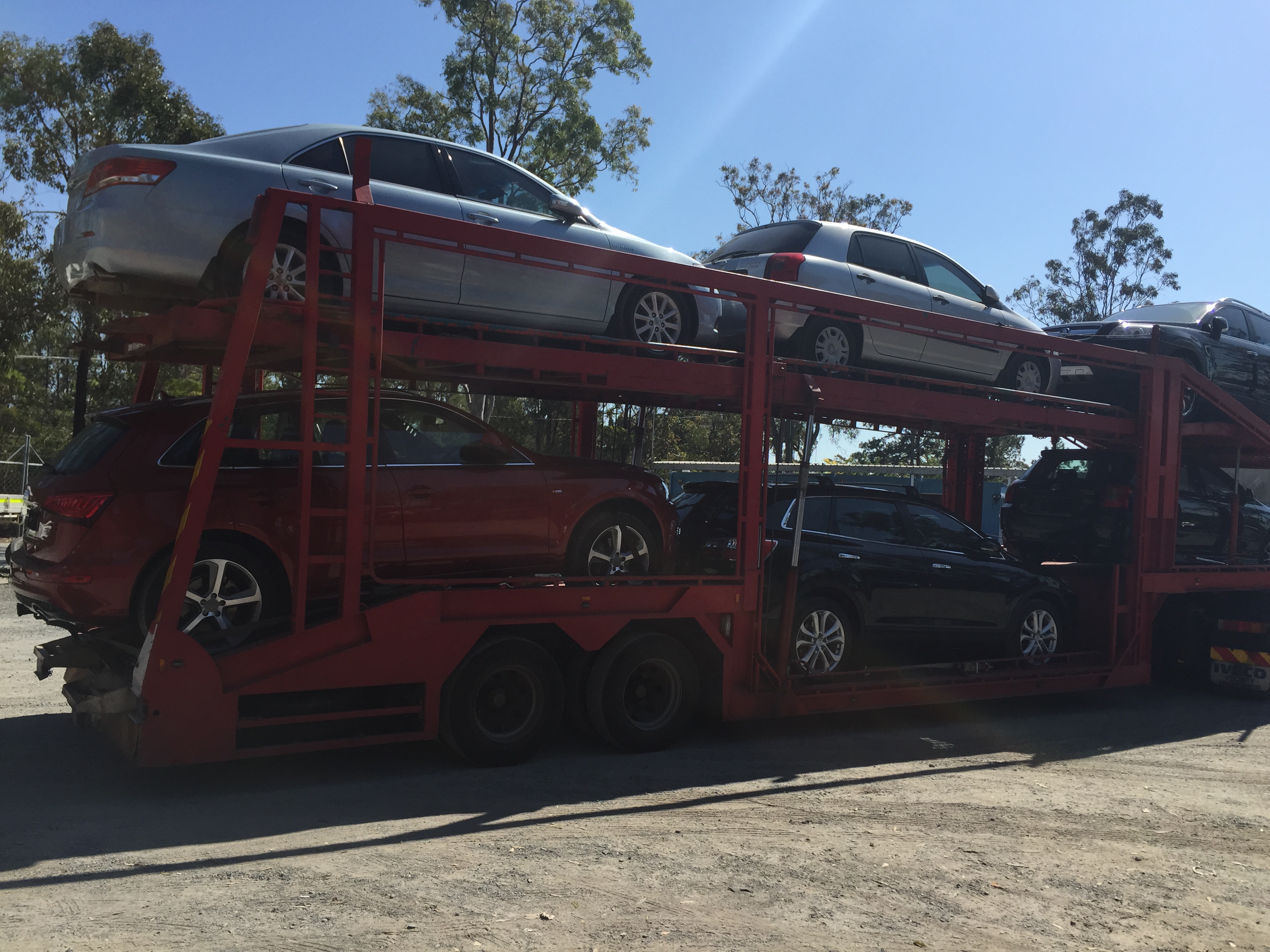 Auto Mover Red Car Carrier with Multiple Vehicles Loaded