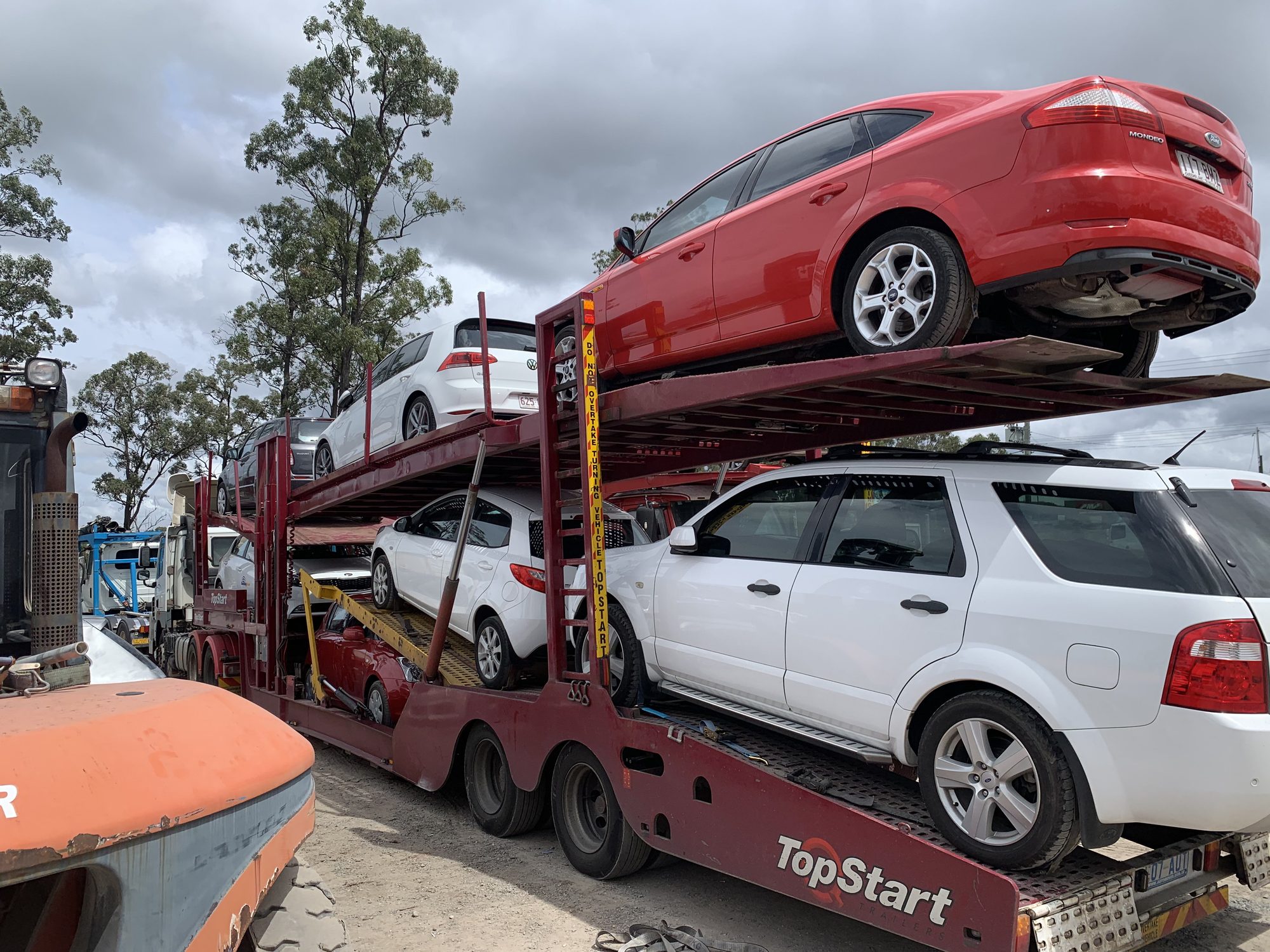 Auto Mover Red Ford Focus on Double-Deck Car Carrier