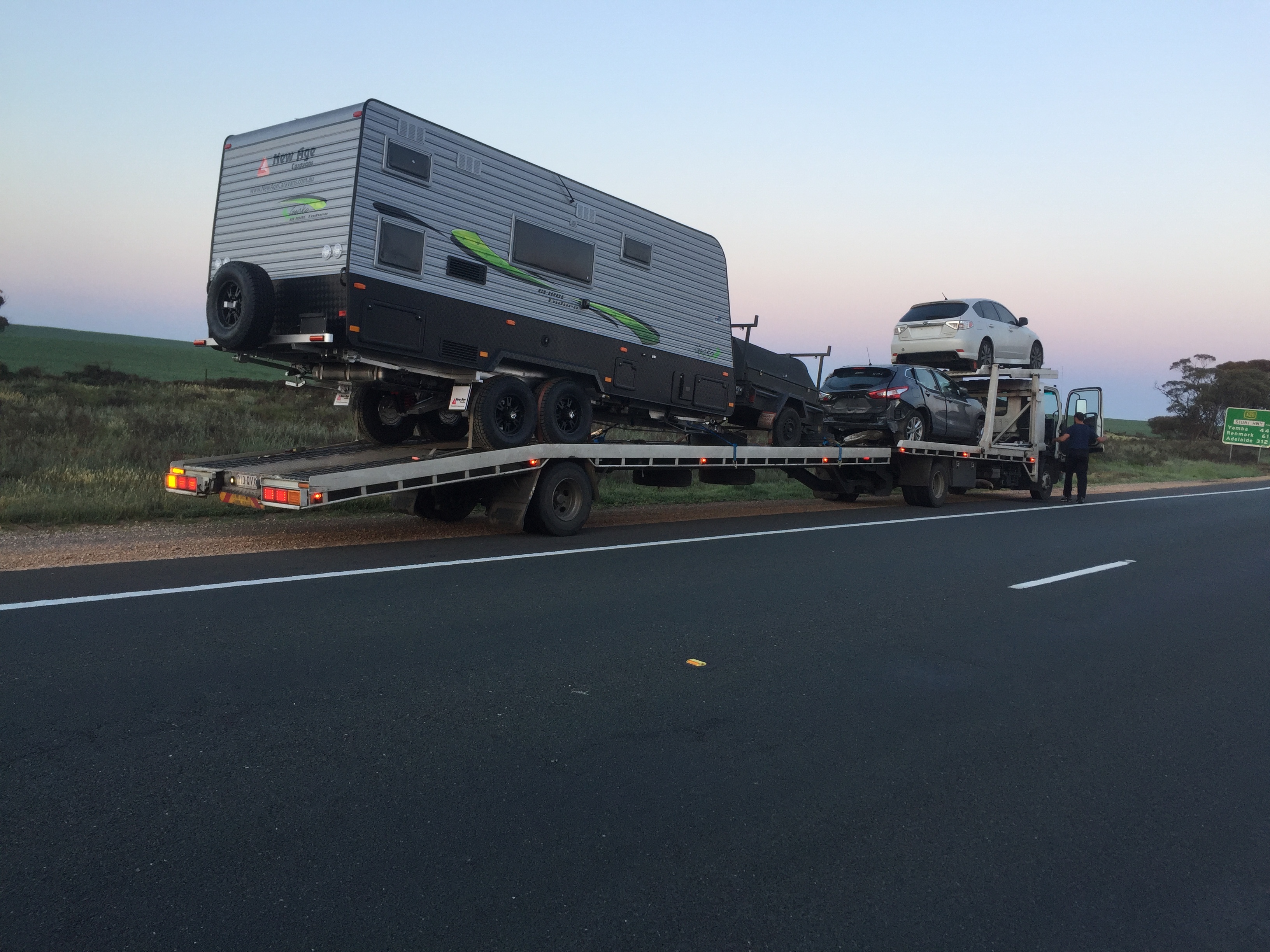 Auto Mover Transporting Caravan and Multiple Vehicles