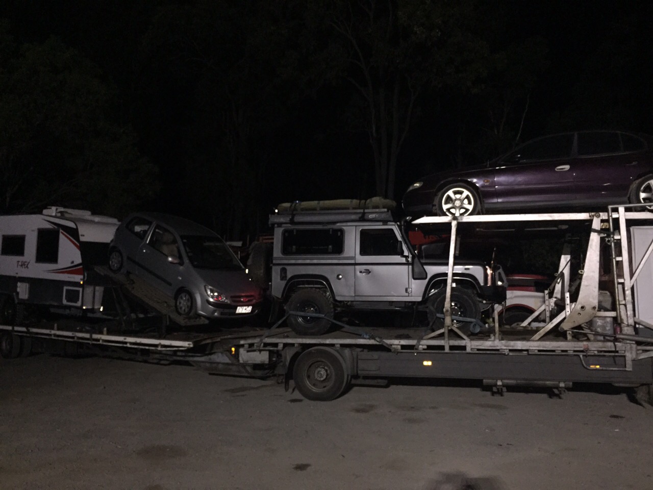 Auto Mover Transporting Multiple Vehicles on Enclosed Carrier