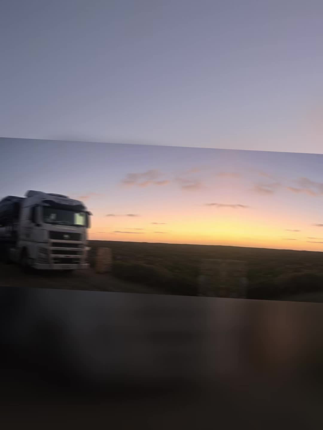 Auto Mover Truck on Highway at Sunset